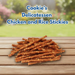 Load image into Gallery viewer, Chicken and Rice Stickies on a wooden surface with a garden background