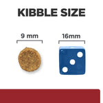 Load image into Gallery viewer, Comparison of kibble size to a blue die showing measurements.
