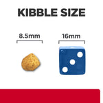 Load image into Gallery viewer, Comparison of kibble size with a 8.5mm rock and a 16mm blue die on a white background.