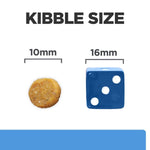 Load image into Gallery viewer, Comparison of kibble size to a blue die showing measurements.