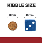 Load image into Gallery viewer, Comparison of kibble size to a blue die with measurements on a white background