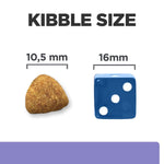 Load image into Gallery viewer, Comparison of kibble size to a blue die showing measurements.