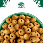 Load image into Gallery viewer, Dog food pellets in a green bowl with a brand logo in the background