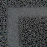 Load image into Gallery viewer, Close-up of a textured black mat with a geometric pattern