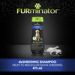 Load image into Gallery viewer, FURminator deshedding shampoo bottle on a dark background with visible text and branding.
