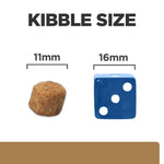 Load image into Gallery viewer, Comparison of kibble size to a blue die with measurements on a white background