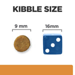 Load image into Gallery viewer, Comparison of kibble size with a 9 mm diameter round kibble and a 16 mm blue die.