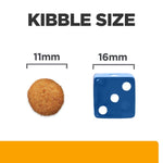 Load image into Gallery viewer, Comparison of kibble size with a blue die showing measurements on a white background