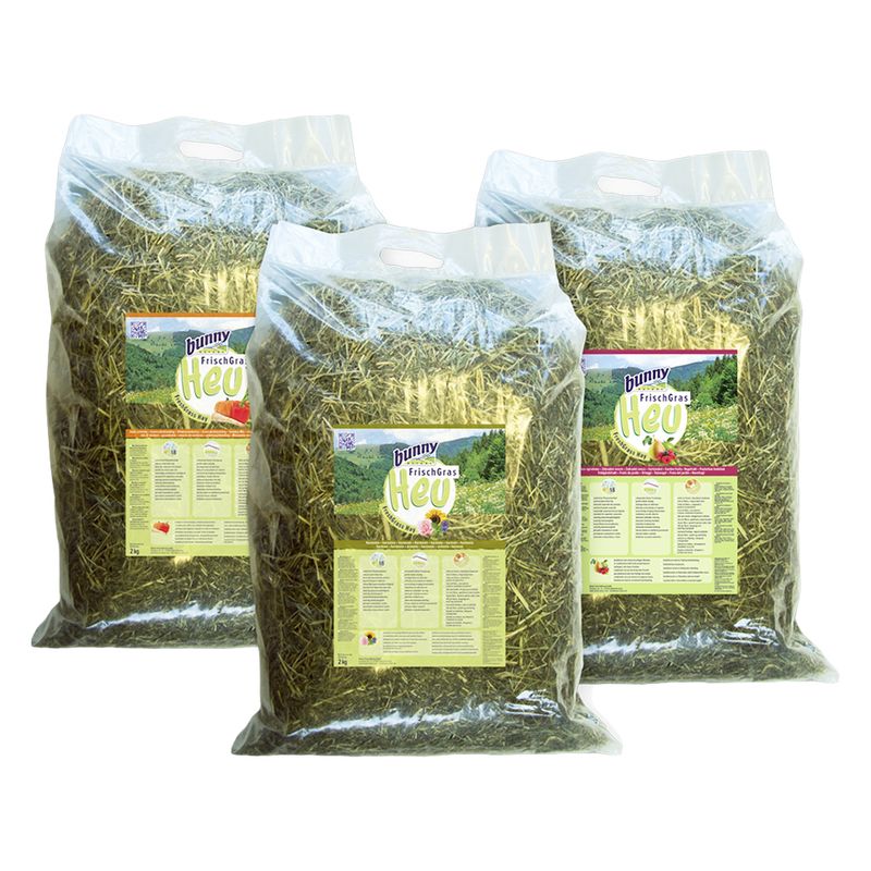 Three bags of Bunny Fresh Hay on a white background