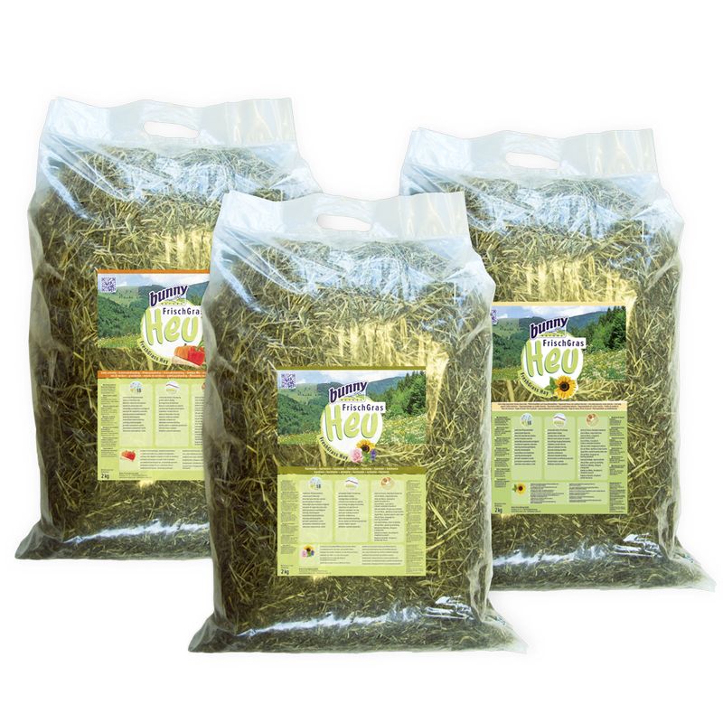 Three bags of hay with bunny brand labels on a white background