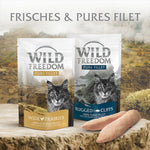 Load image into Gallery viewer, Two packages of Wild Freedom cat food with scenic background
