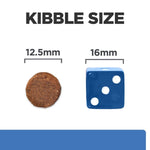 Load image into Gallery viewer, Comparison of kibble size to a blue die showing measurements.
