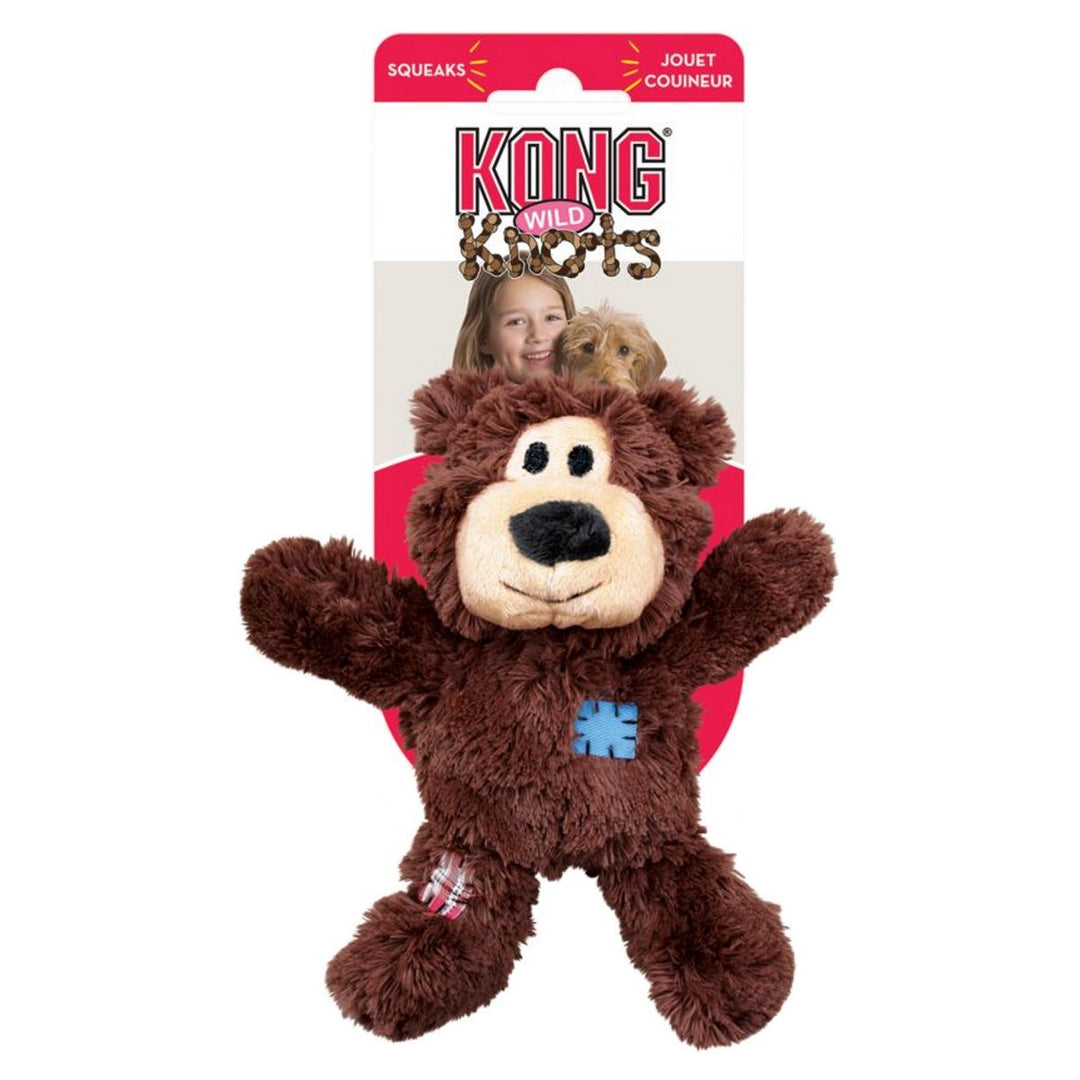 Brown plush dog toy with a blue star on a KONG packaging