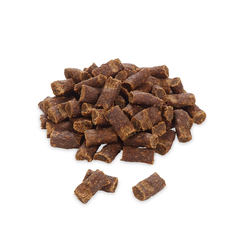 Pile of brown pet treats on a white background