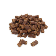 Pile of brown pet treats on a white background