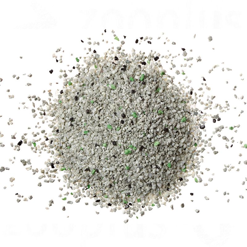 Small stones with green and black specks on a white background