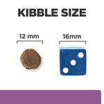 Load image into Gallery viewer, Comparison of kibble size with a 12mm round kibble and a 16mm dice for scale on a white background.
