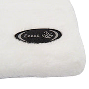 White pillow with a black logo on a white background