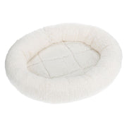 Round white pet bed on a white background