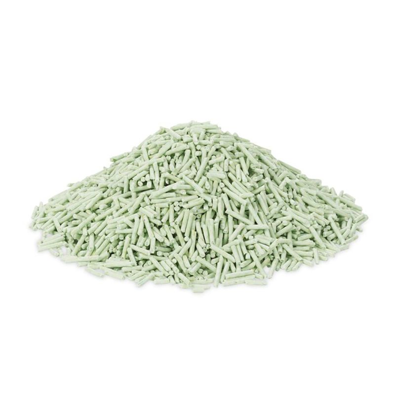 Pile of light green textured material on a white background