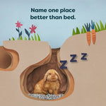 Load image into Gallery viewer, Illustration of a rabbit in a burrow with flowers and carrots, featuring text &#39;Name one place better than bed.&#39;
