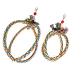 Load image into Gallery viewer, Two colorful braided rope toys with hanging charms on a white background
