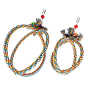 Two colorful braided rope toys with hanging charms on a white background