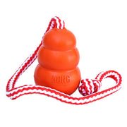 Red KONG dog toy with a rope on a white background