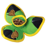 Load image into Gallery viewer, Green shamrock-shaped pet toy with a yellow rim and black interior, filled with treats on a white background.
