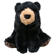 Black plush bear toy on a white background