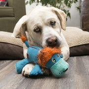 Dog playing with a toy on a wooden floor