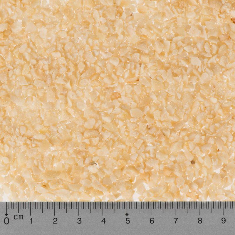 Close-up of beige textured material with a ruler at the bottom
