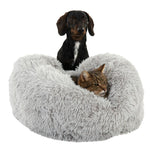 Load image into Gallery viewer, Dog and cat resting in a fluffy gray donut bed on a white background
