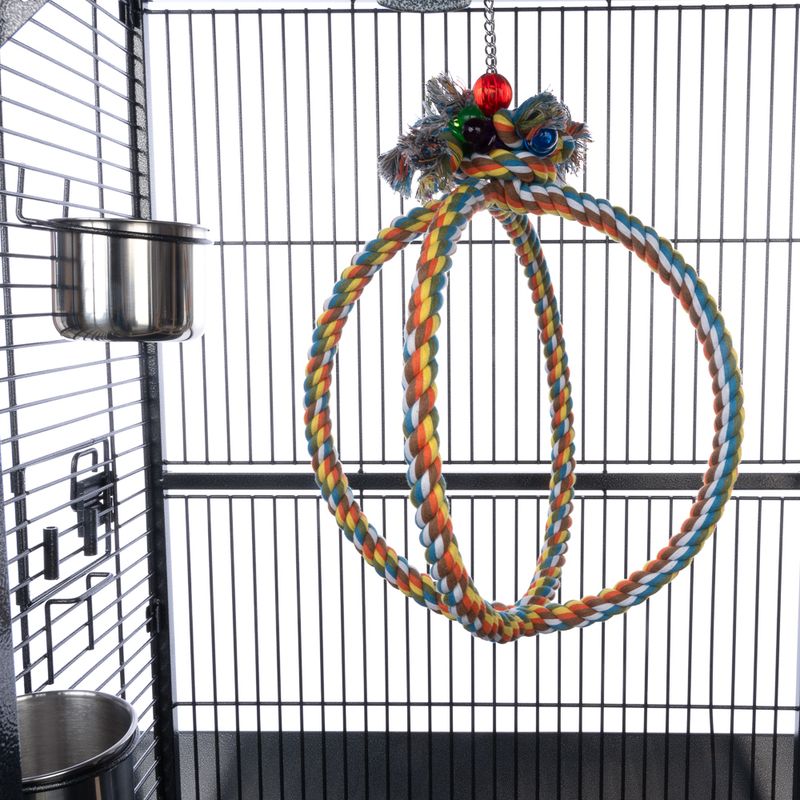 Colorful braided rope hanging toy inside a bird cage.