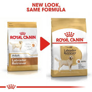 Two packages of Royal Canin Labrador Retriever dog food with a red arrow and text indicating 'New Look, Same Formula'.