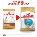 Load image into Gallery viewer, Two packages of Royal Canin Labrador Retriever dog food with text indicating a new look and upgraded formula.
