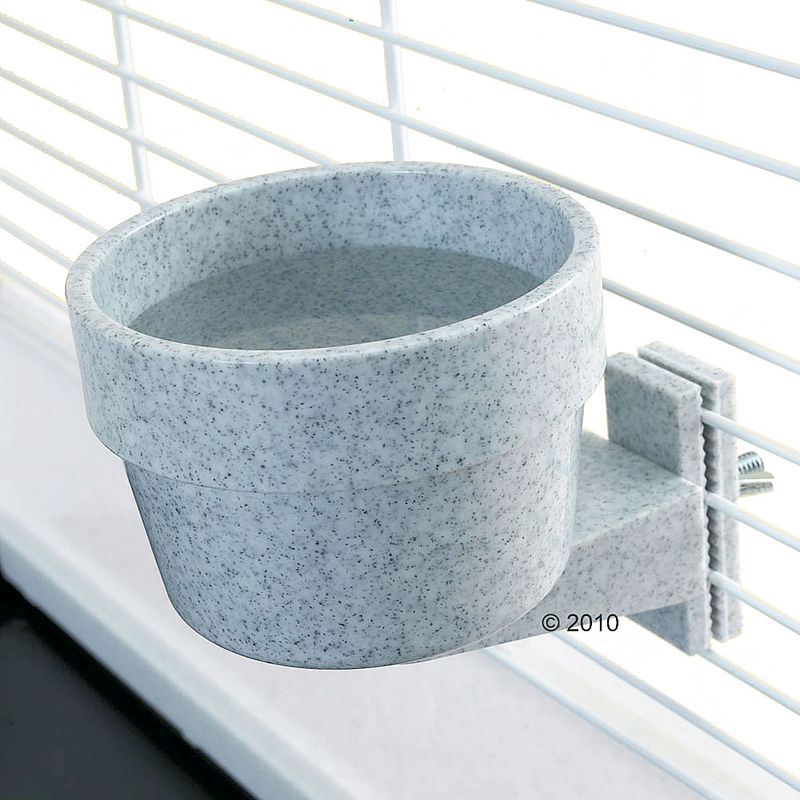 Speckled gray planter on a white window sill