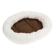 Round pet bed with white fleece exterior and brown interior on a white background