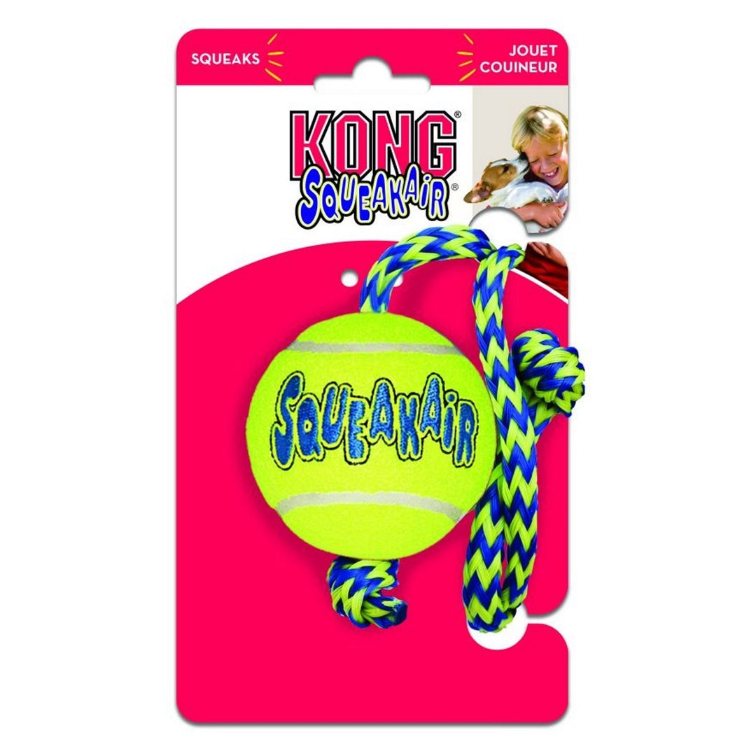 Kong Squeakair dog toy with a tennis ball and rope on a pink packaging