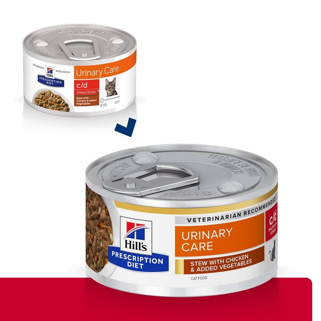 Two cans of Hills Prescription Diet Urinary Care cat food on a white background