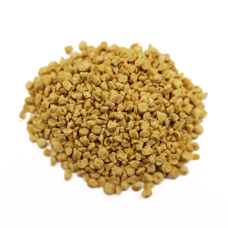 Yellowish granular substance on a white background