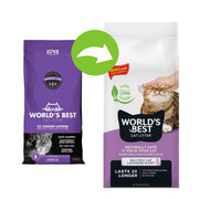 Two packages of World's Best Cat Litter with a hand holding a cat on the white package.